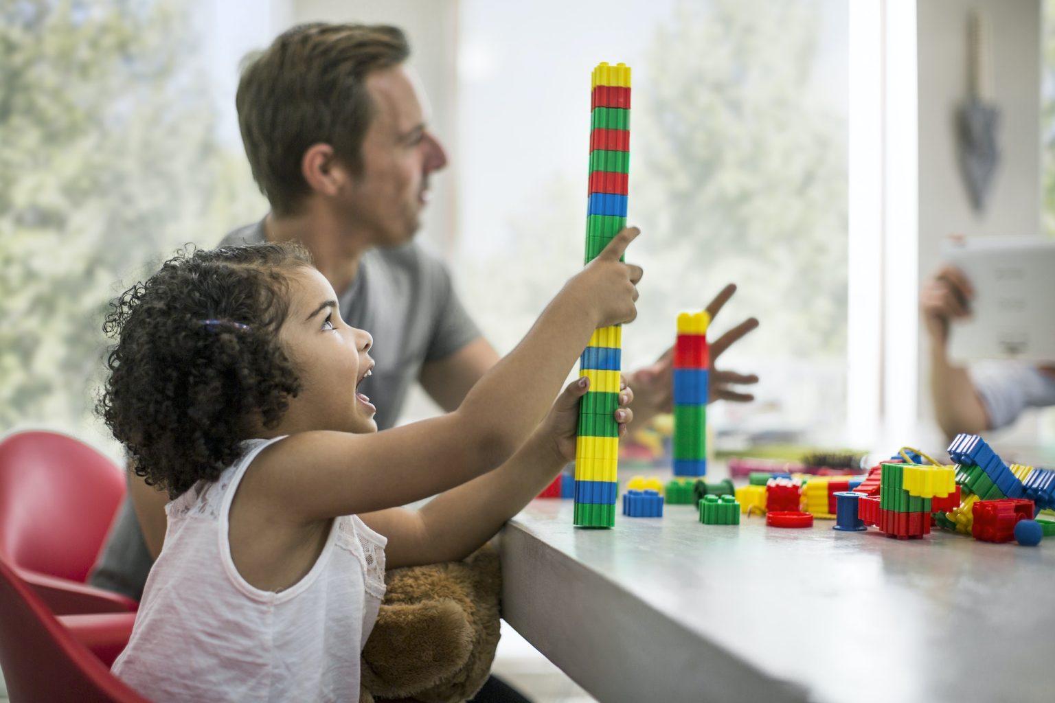 Family playing with building blocks