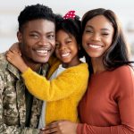 Portrait Of Happy Military Family, Black Soldier Father, Wife And Little Daughter